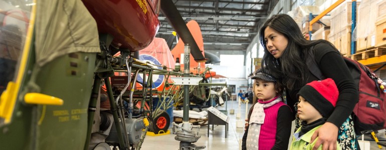 Family learning about military equipment