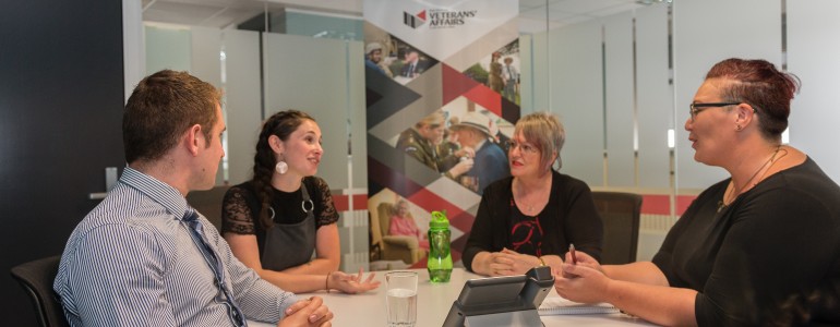 Veterans' Affairs staff in a meeting