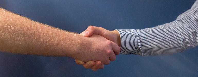Two people shaking hands