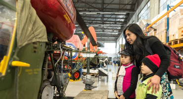 Family learning about military equipment