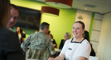 Royal New Zealand Navy sailor chatting with friends