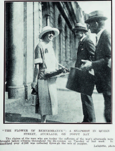 A lady in the 20's selling poppies to two men