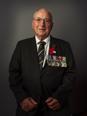 Portrait of a man wearing a suit with medals