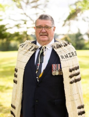 Portrait of BJ Clark wearing a ceremonial Māori cloak
