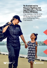 A woman in Navy uniform holding the hand of a smiling young girl