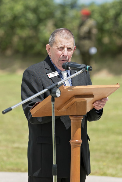 Barry Rankin speaking into a microphone at a podium