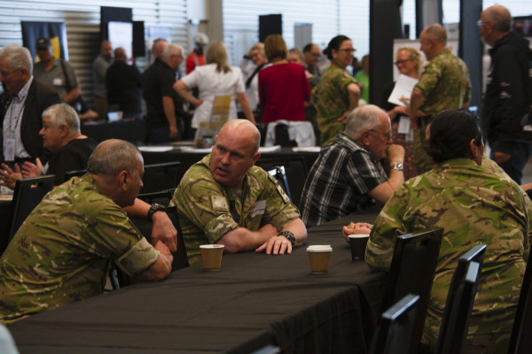 Uniformed men sitting at Christchurch event