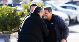 Two men greet each other at a Waikato forum